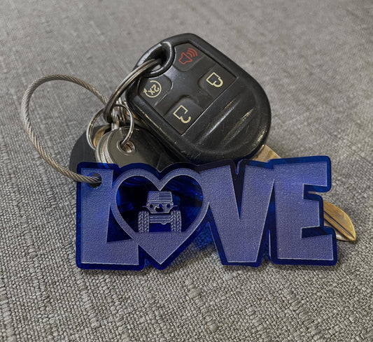 LOVE keychain with Jeep heart design on a set of keys, highlighting its compact charm.